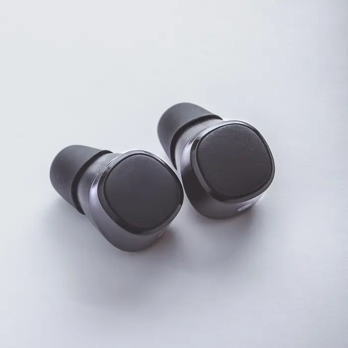 A pair of black wireless earbuds