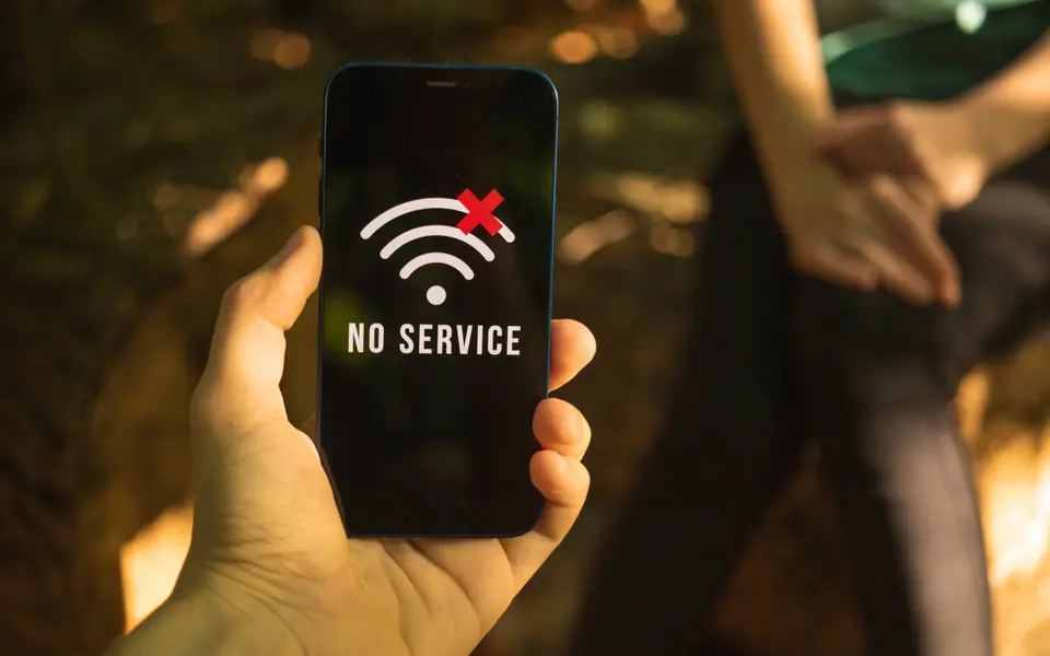 A hand holding a phone showing a 